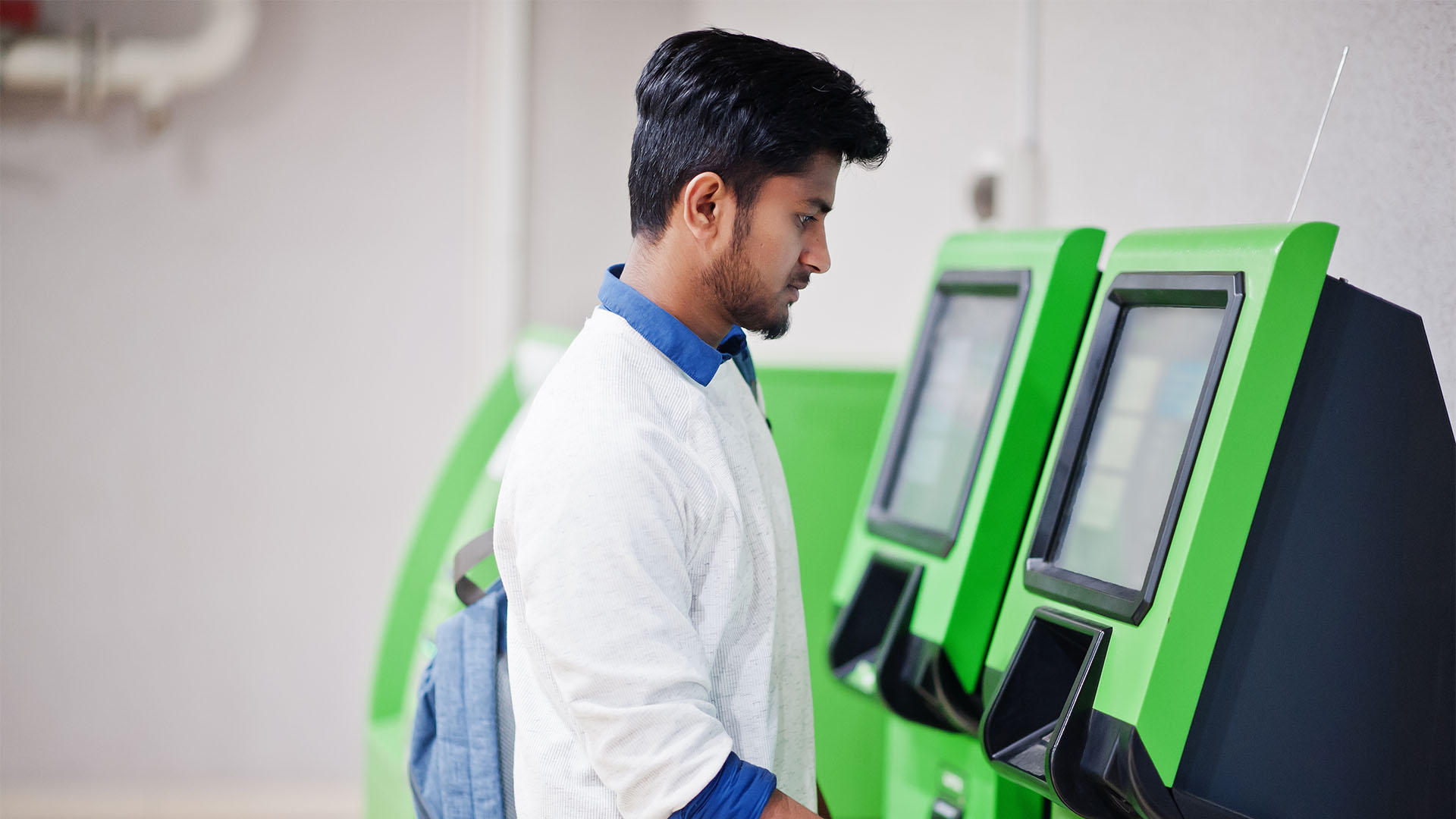 untitled 1 0003 young asian man put his credit card removes cash from green atm